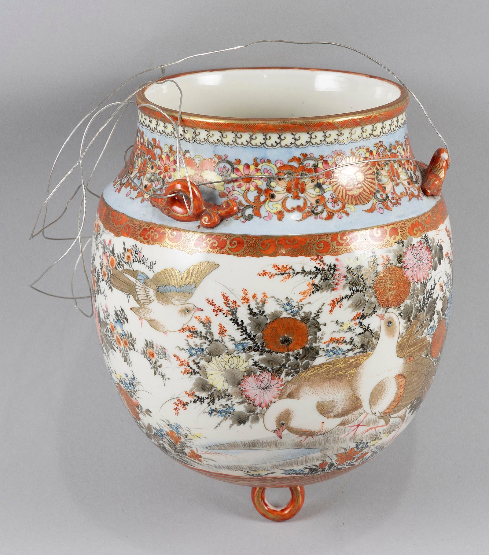JAPANESE KUTANI PORCELAIN BELL-FORM HANGING PLANTER Late 19th/Early 20th Century Height 10.5".: JAPANESE KUTANI PORCELAIN BELL-FORM HANGING PLANTER Late 19th/Early 20th Century Body decorated with birds in a flower-filled landscape. Two small applied handles at neck. Height 10.5". Diameter 6".
