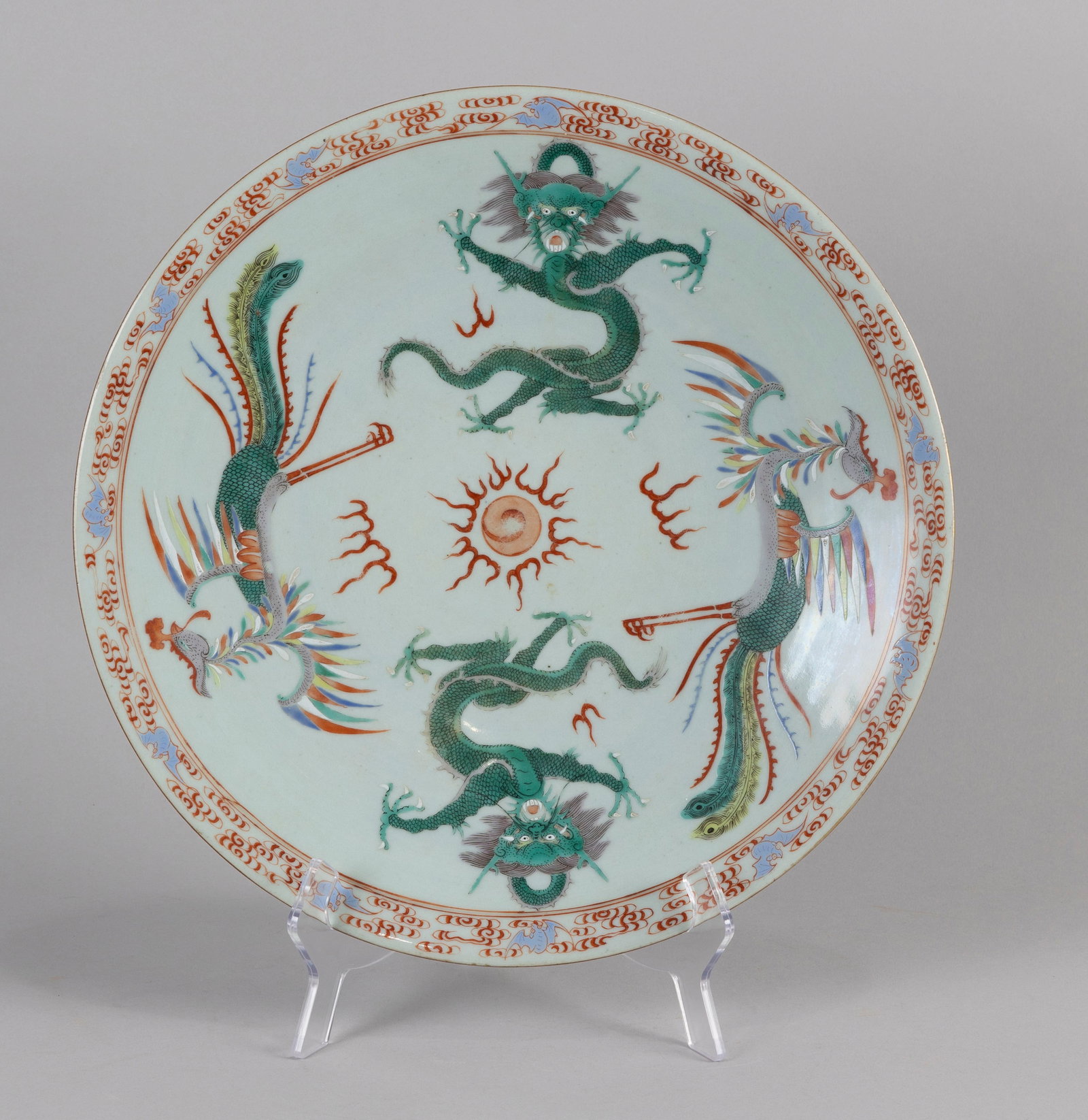 CHINESE FAMILLE ROSE PORCELAIN CHARGER 19th Century Diameter 15".: CHINESE FAMILLE ROSE PORCELAIN CHARGER 19th Century Alternating decoration of dragons and phoenixes surrounding a central fiery pearl. Bat and cloud border. Bat decoration on base. Diameter 15".