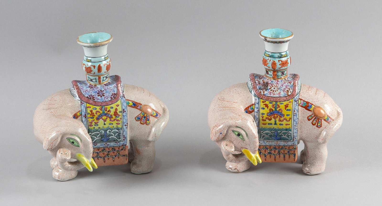 PAIR OF CHINESE FAMILLE ROSE PORCELAIN JOSS STICK CANDLESTICKS 20th Century Heights 7.5". Lengths: PAIR OF CHINESE FAMILLE ROSE PORCELAIN JOSS STICK CANDLESTICKS 20th Century Formed as caparisoned elephants and decorated with Chinese elements. Heights 7.5". Lengths 7". Widths 3".