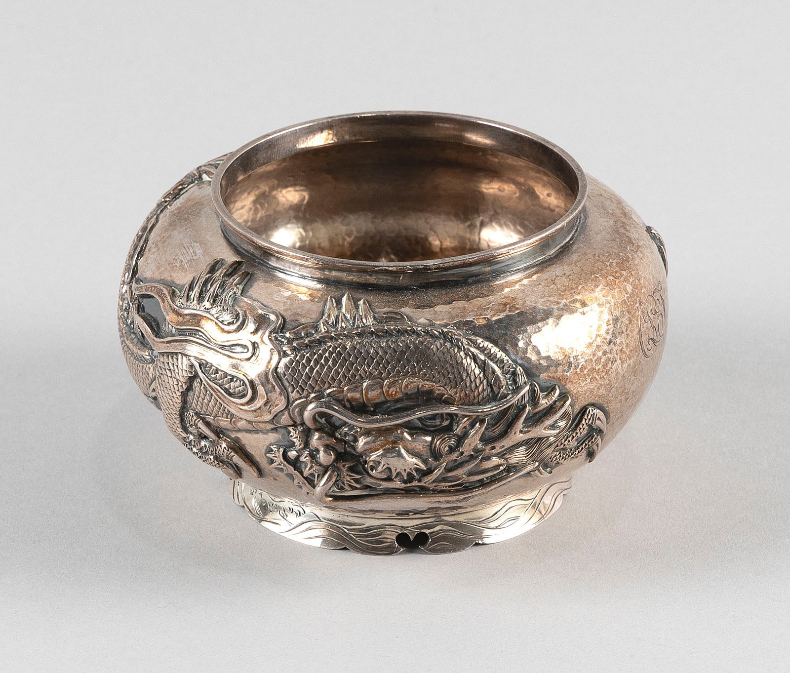 BISANSHA HAND-HAMMERED SILVER BOWL Japan, Early 20th Century Approx. 7.7 troy oz.: BISANSHA HAND-HAMMERED SILVER BOWL Japan, Early 20th Century Raised dragon decoration about the body. Monogrammed. Marked and signed on base. Height 3". Diameter 4.5". Approx. 7.7 troy oz.