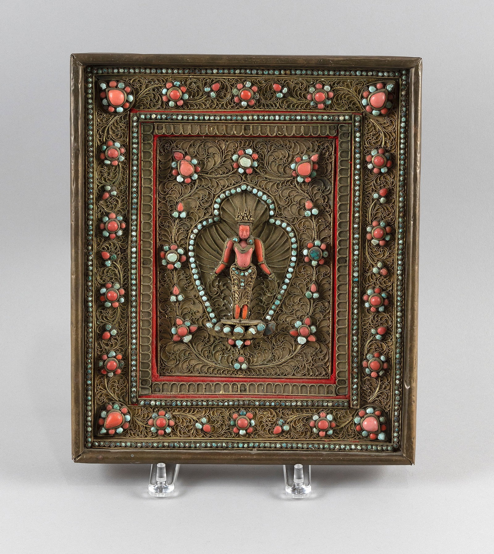 NEPALESE VOTIVE PLAQUE Late 19th Century Framed 12" x 10".: NEPALESE VOTIVE PLAQUE Late 19th Century Coral Vishnu at center surrounded by inlaid turquoise and coral cabochons on a filigree ground. Framed 12" x 10".