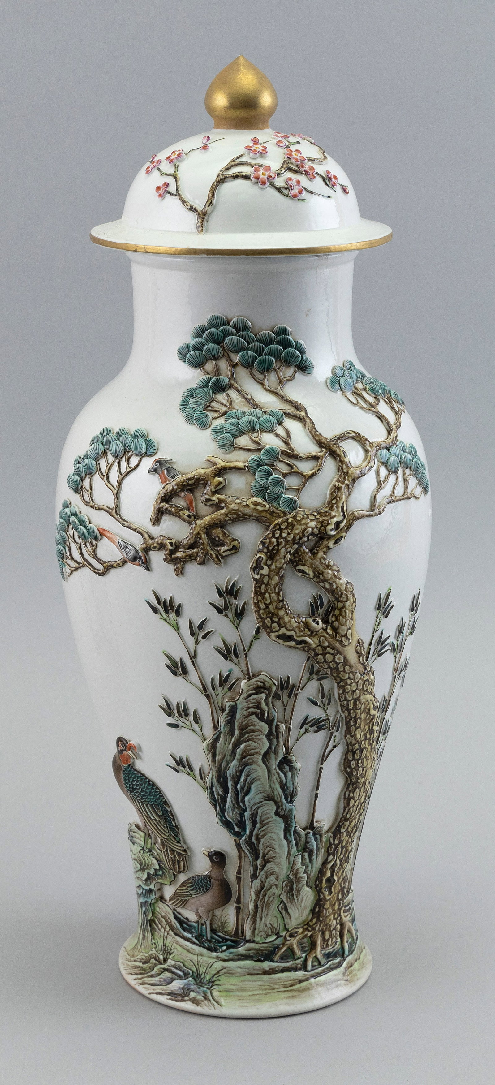 CHINESE POLYCHROME PORCELAIN COVERED BALUSTER VASE 20th Century Height 16".: CHINESE POLYCHROME PORCELAIN COVERED BALUSTER VASE 20th Century Obverse with raised decoration of birds in and around pine branches, bamboo and rockery, and reverse with seal marks and calligraphy. Do