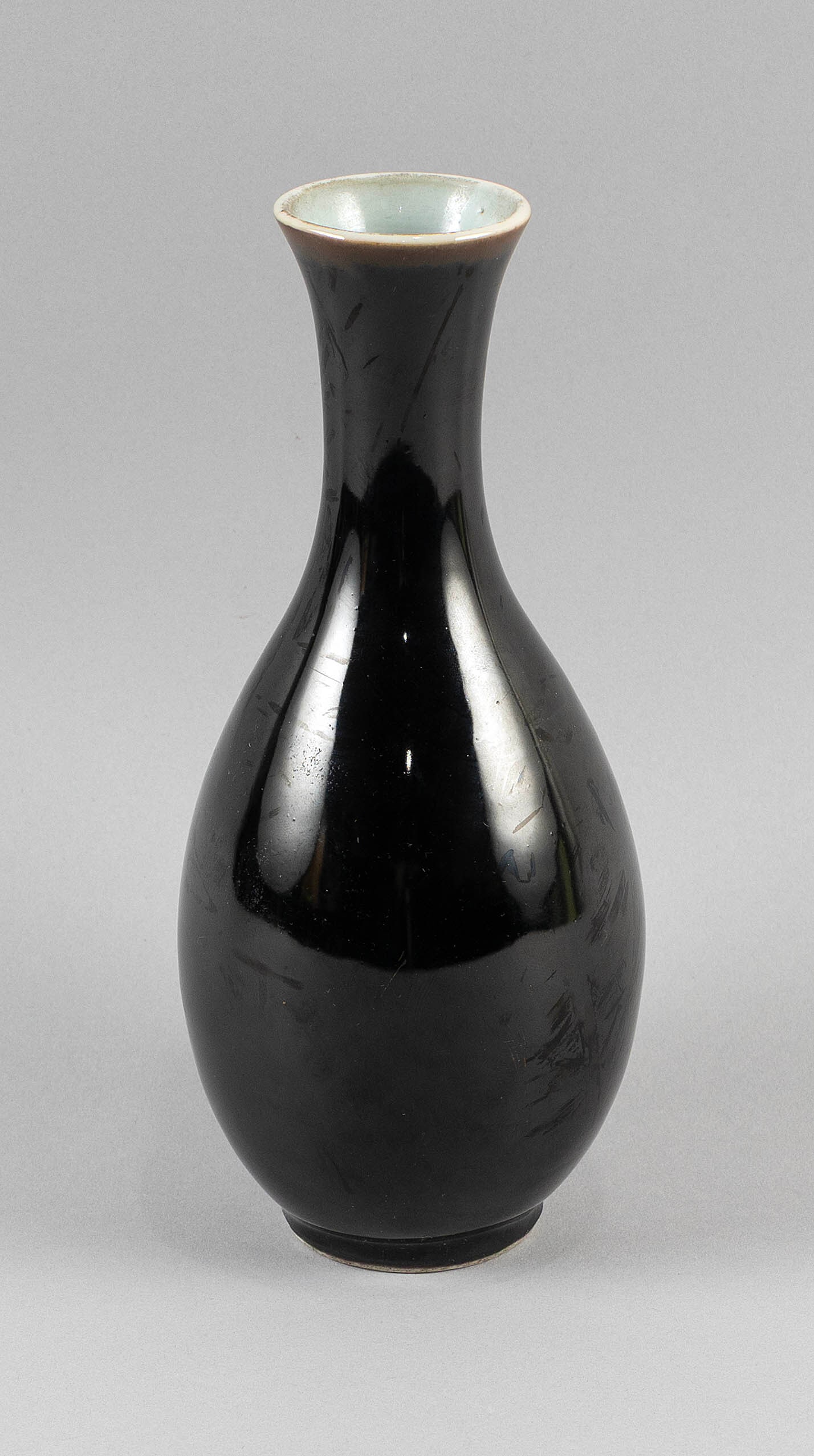 CHINESE MIRROR BLACK PORCELAIN SLENDER BALUSTER VASE Possibly Qianlong Period Height 8.5" .: CHINESE MIRROR BLACK PORCELAIN SLENDER BALUSTER VASE Possibly Qianlong Period Light brown coloring under rim. Old label on base. Height 8.5" .