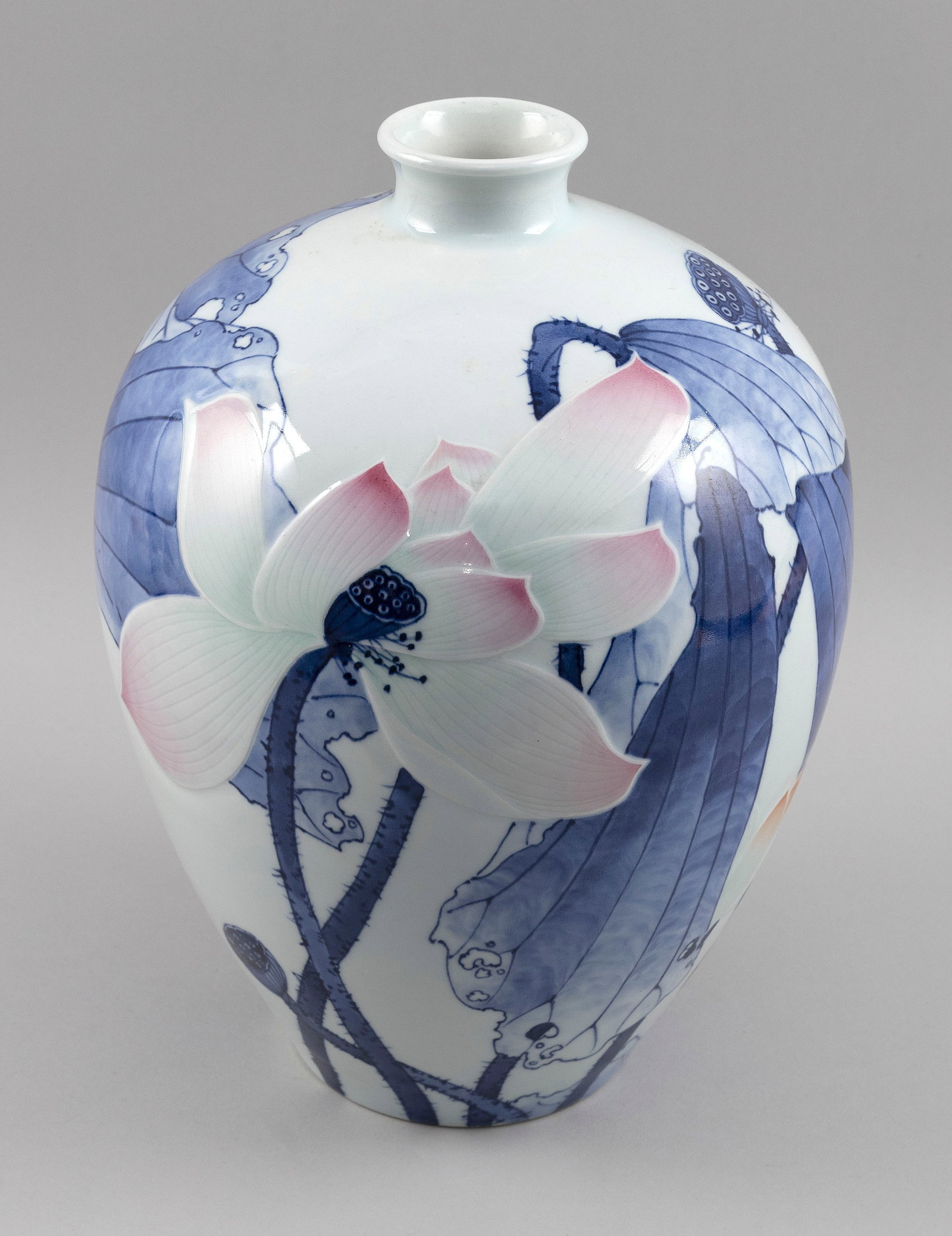 CHINESE PORCELAIN LOTUS VASE 20th Century Height 13".: CHINESE PORCELAIN LOTUS VASE 20th Century Raised pink and white lotus decoration against a blue and white ground. Marked on base. Height 13".