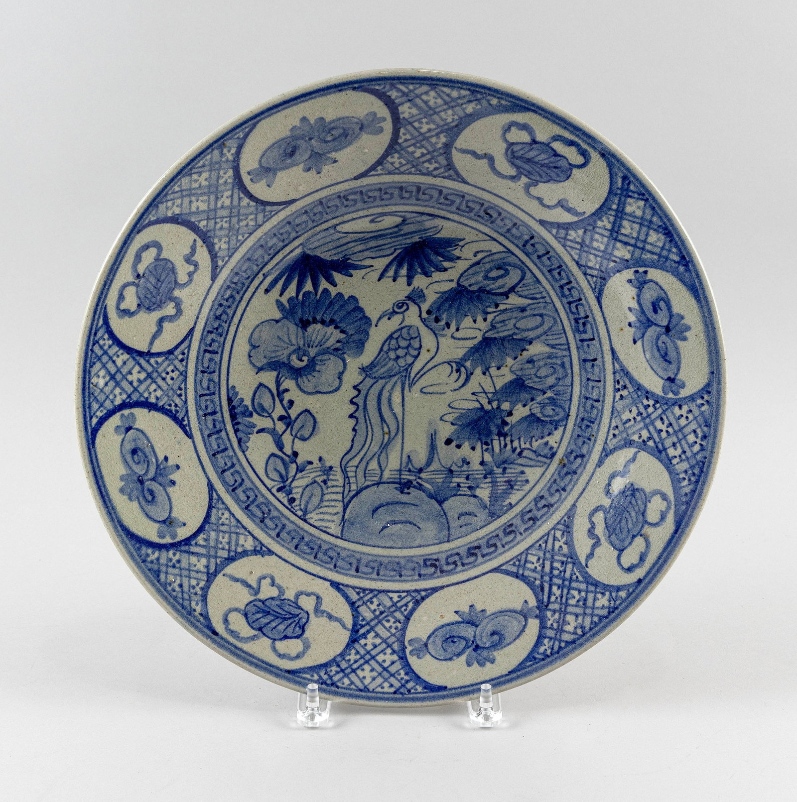 CHINESE BLUE AND WHITE PORCELAIN SHALLOW BOWL Late 19th/Early 20th Century Diameter 15".: CHINESE BLUE AND WHITE PORCELAIN SHALLOW BOWL Late 19th/Early 20th Century Central decoration of a bird in a landscape. Diapered border with auspicious elements cartouches. Diameter 15". Provenance: P
