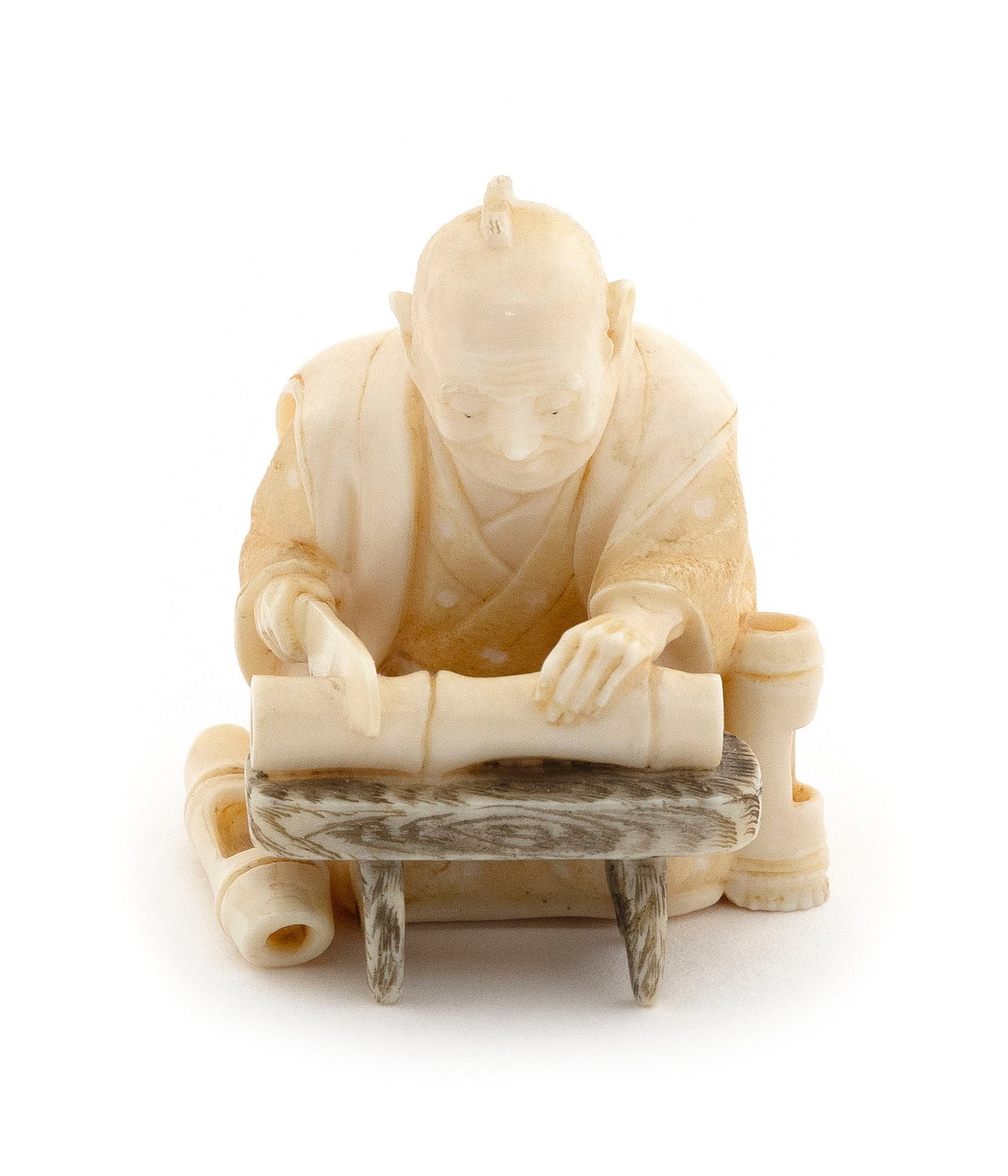JAPANESE CARVED IVORY NETSUKE Circa 1900 Height 1.625".: JAPANESE CARVED IVORY NETSUKE Circa 1900 Shokunin sawing bamboo. Signed in a rectangular reserve on bottom. Height 1.625". Provenance: Private South Carolina Collection.