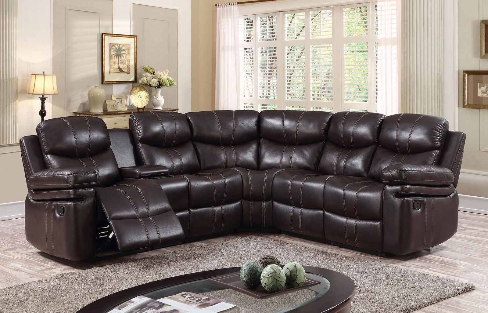 LEXINGTON CHOCOLATE BROWN RECLINER SECTIONAL: With its sleek aesthetic, this is the Delectable Delight of our sectionals. Apart from the attached chair and recliners, this set also includes a console and a wedge and everything is constructed with