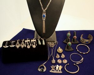 Ethnic & Exotic Sterling Silver Jewelry 24 Pieces: Group lot of sterling silver jewelry including: cuff w/lapis, 3 bangles, 3 necklaces - lapis, onyx, Tut, 6 prs or earrings - lapis stone missing on one- carnelian onyx, 3 rings - carnelian, jade & mal
