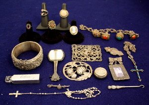 Early 20thC Sterling Silver Jewelry Lot: Early 20th century sterling silver including: repousse cuff, filigree buckle with griffin, mother of pearl banjo brooch, rosary beads and case dated 1921, Victorian "Mother" pin, cross w/turquoise, ch