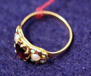 14kt Victorian Garnet Ring w/Opal & Seed Pearls: 14kt yellow gold Victorian ring with 8mm x 7mm center garnet surrounded by two pearls and 8 tiny opals. Ring size 6. 2.3g/1.5dwt.