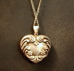 Art Nouveau Sterling Silver Locket with Chain: Art Nouveau sterling silver repousse locket pendant on 24"l sterling necklace. 14.1g/.455ozt.