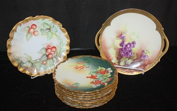 9 Limoges Fruit & Flower Decorated Plates: Lanternier Cake Plate w/grapes. Light gilt wear, light scratches to gilt. 11.5"; 10" Plate decorated w/cherries. 6 point star mark, T&V 8.5" plate w/grapes; 6 D&C unique flower decorated plates ca. 18