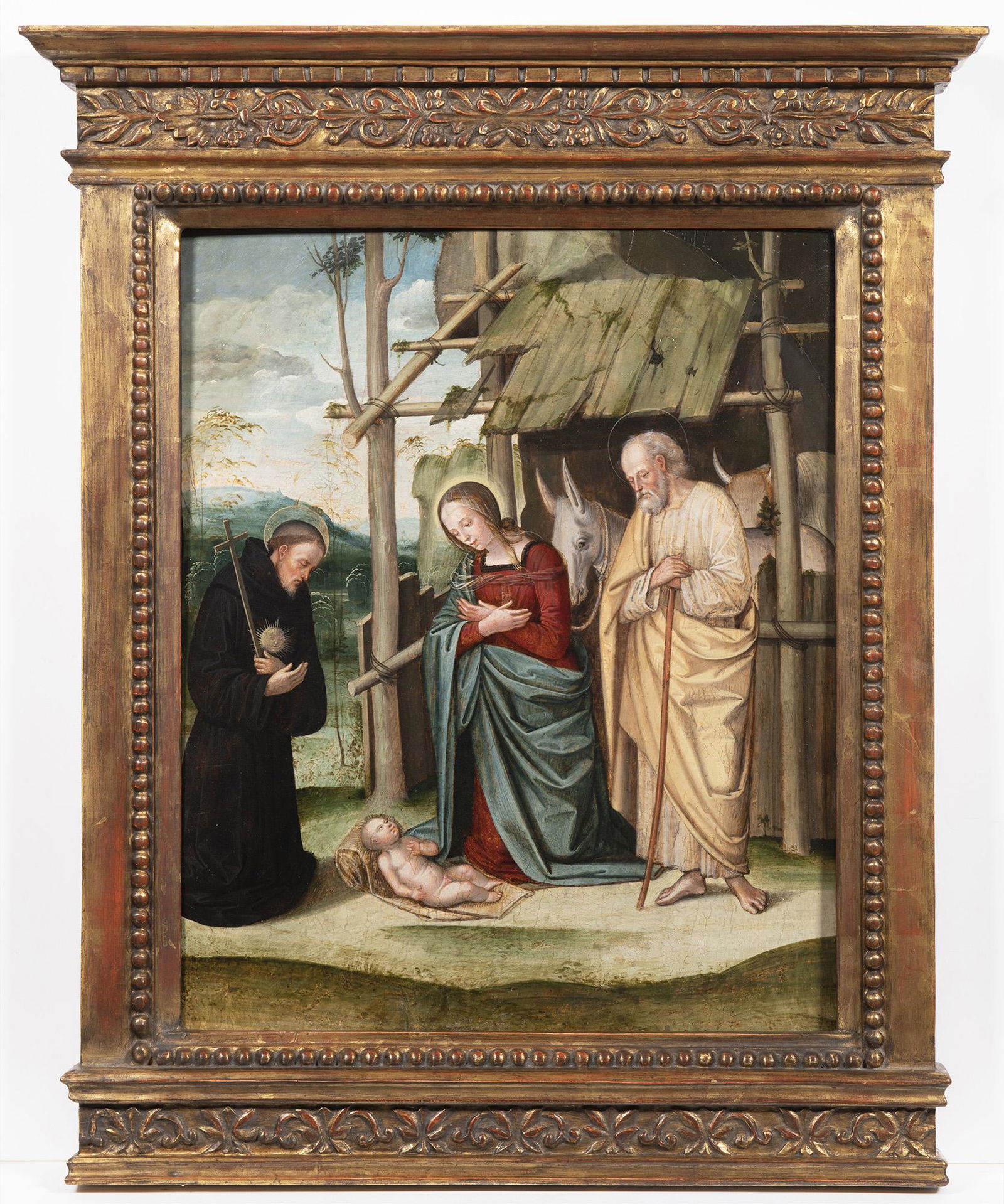 Lorenzo Costa (1460 Ferrara 1535 Mantua), Adoration: In front of the ruined hut, is the Holy Family. Jesus, naked, is lying on the ground on a mat folded on one side to build a pillow for the little one. In front of him are the Virgin, kneeling with her