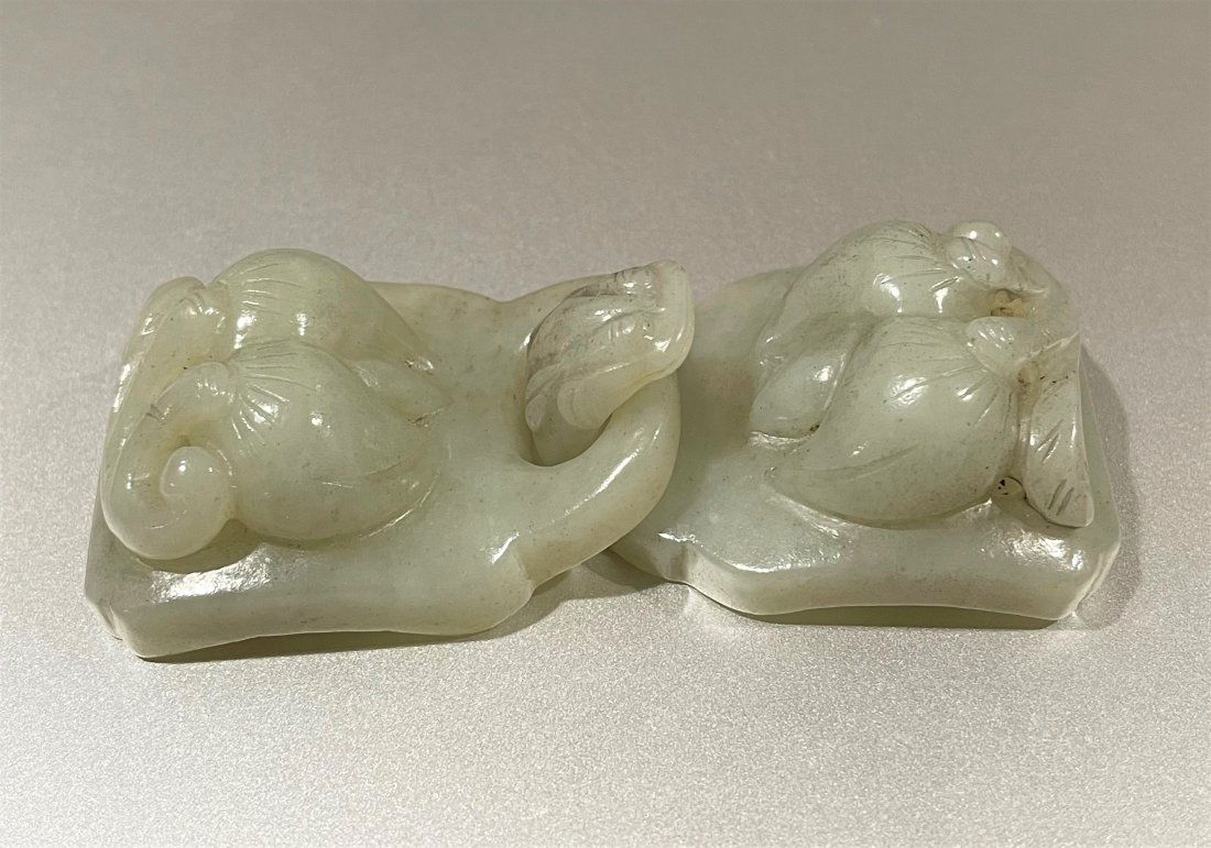 A 19TH CENTURY CARVED JADE BELT HOOK (1 of 4)