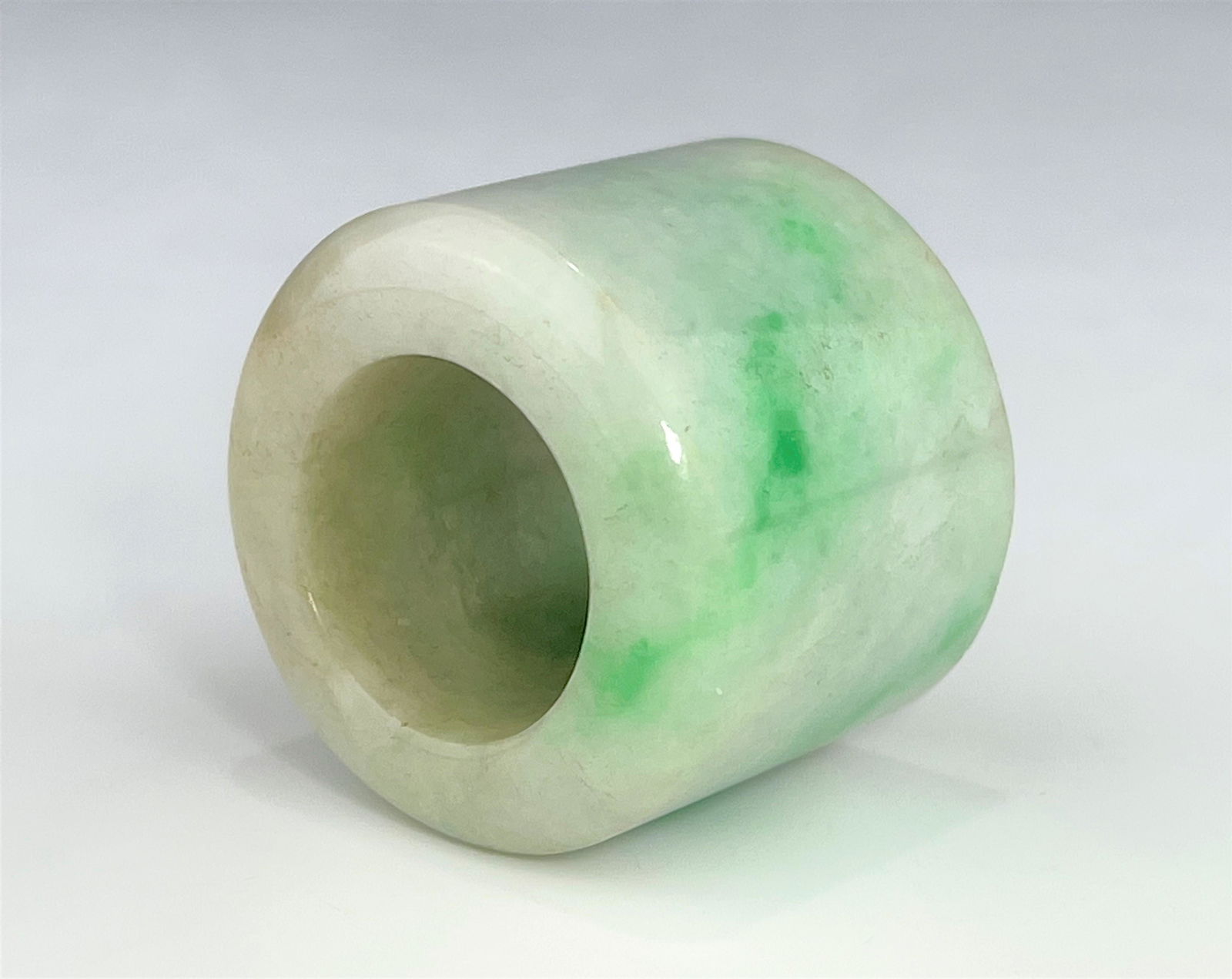 A CHINESE QING DYNASTY JADEITE ARCHER'S RING (1 of 8)