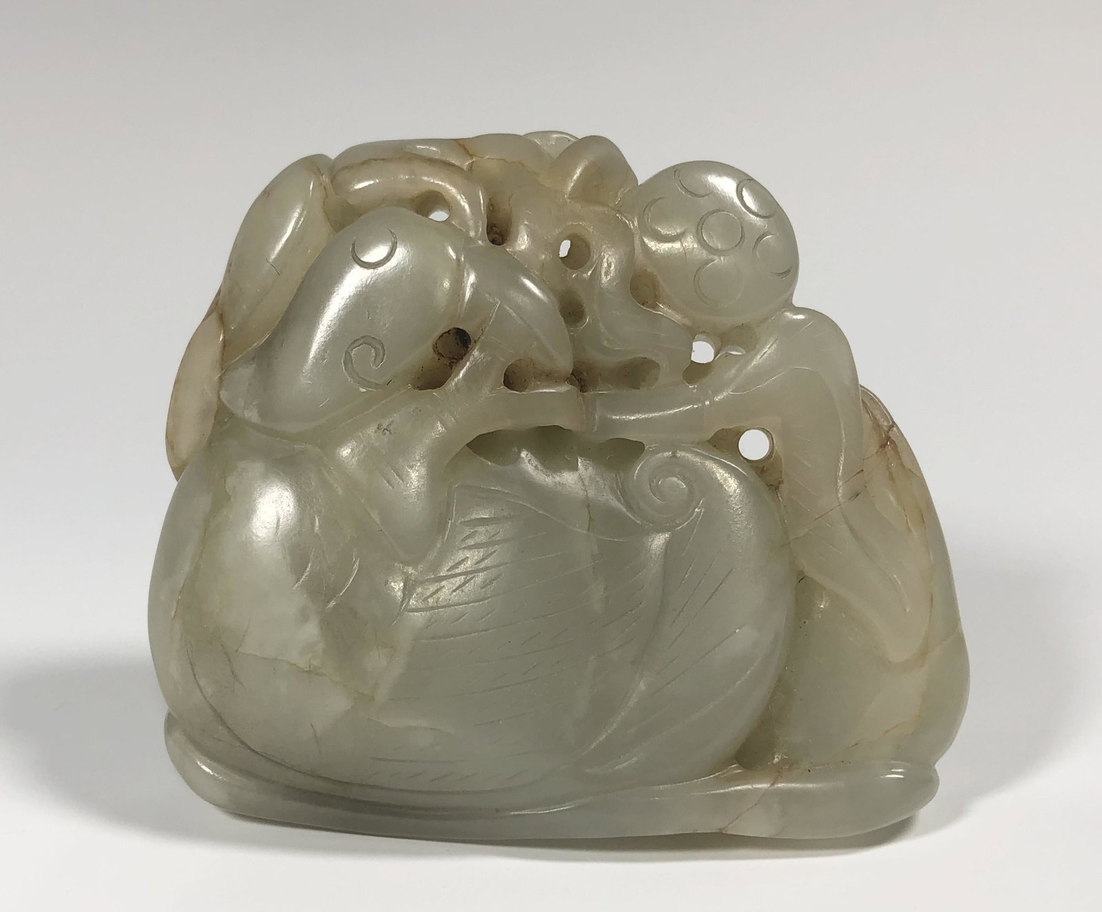 A LARGE 18TH/19TH CENTURY CHINESE YUANYANG JADE CARVING: Depicting a Yuanyang bird and lotus leaves at both sides. Very good condition with natural inclusions. Size: 7 CM W x 6 CM H, 2-3/4" W x 2-3/8"; WT 159.1 grams