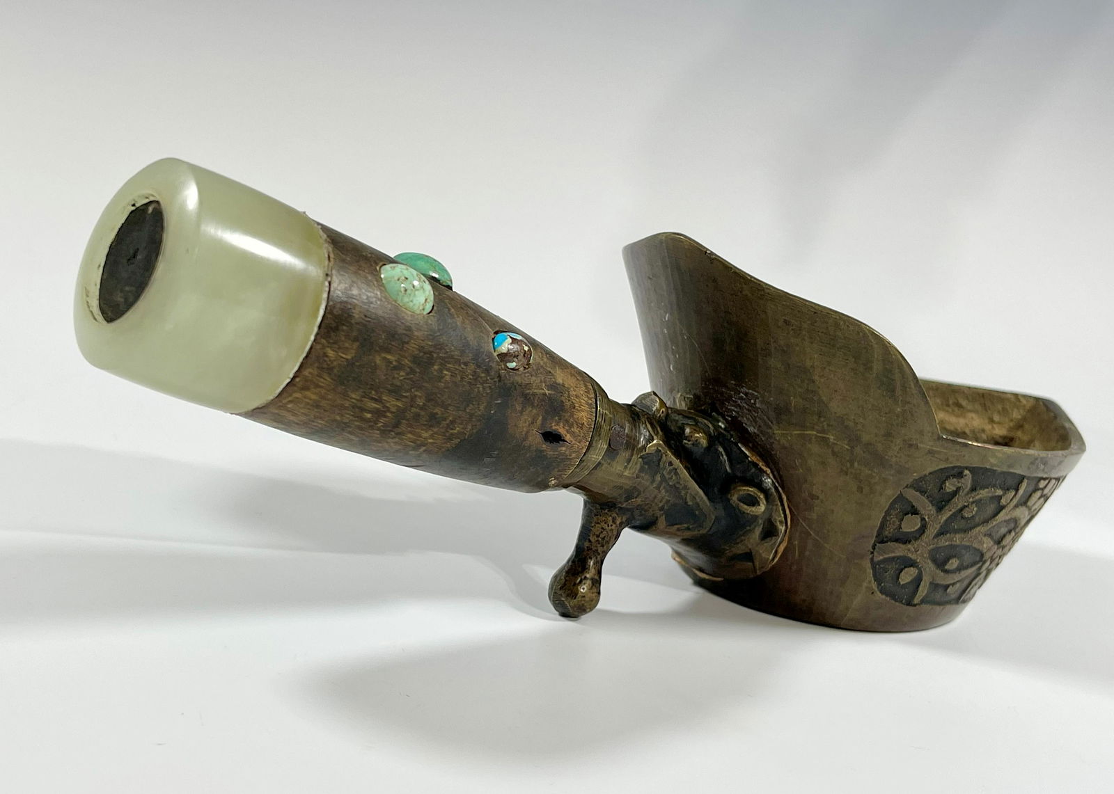 A QING DYNASTY BRONZE SILK IRON WITH AN ARCHER'S RING (1 of 11)