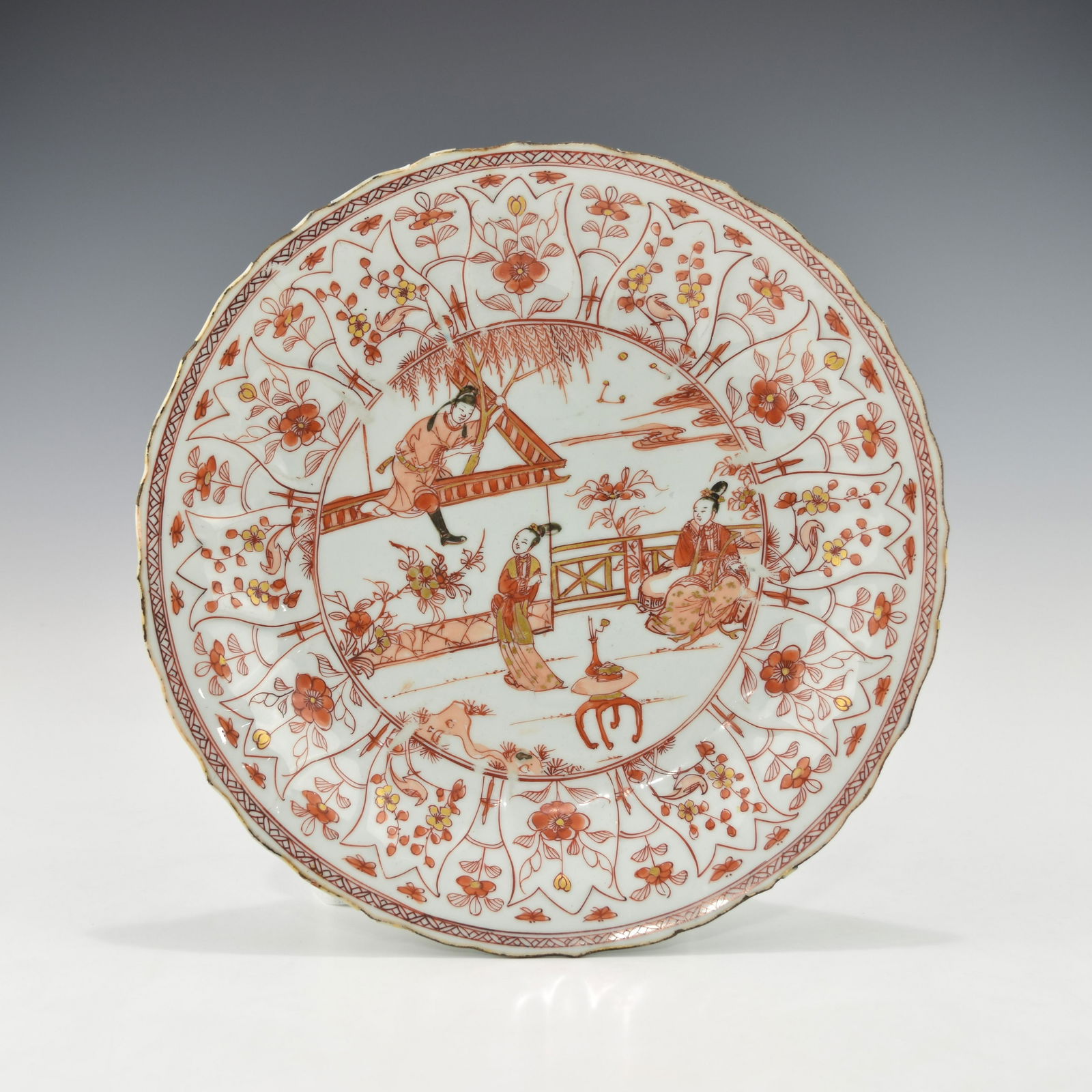 A LARGE CHINESE KANGXI GILT IRON-RED MOLDED PLATE (1 of 3)