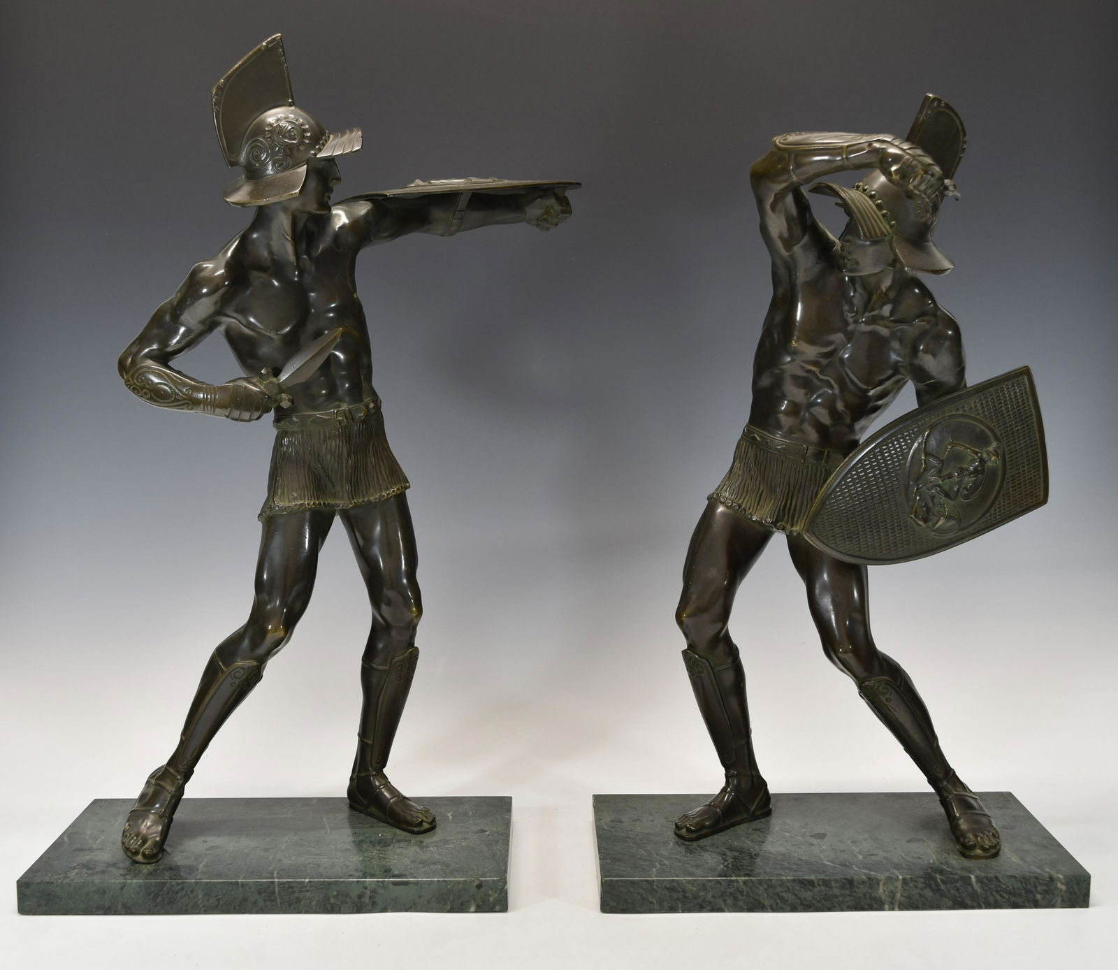 A PAIR OF VINTAGE BRONZE WARRIORS: Very good condition, please refer to the photos for more details. Height: 57.5 CM and 51.5 CM, 22-5/8" and 20-1/4"; Slab size 32 x 16 x 2.2 CM, 12-5/8" x 6-5/16" x 7/8"