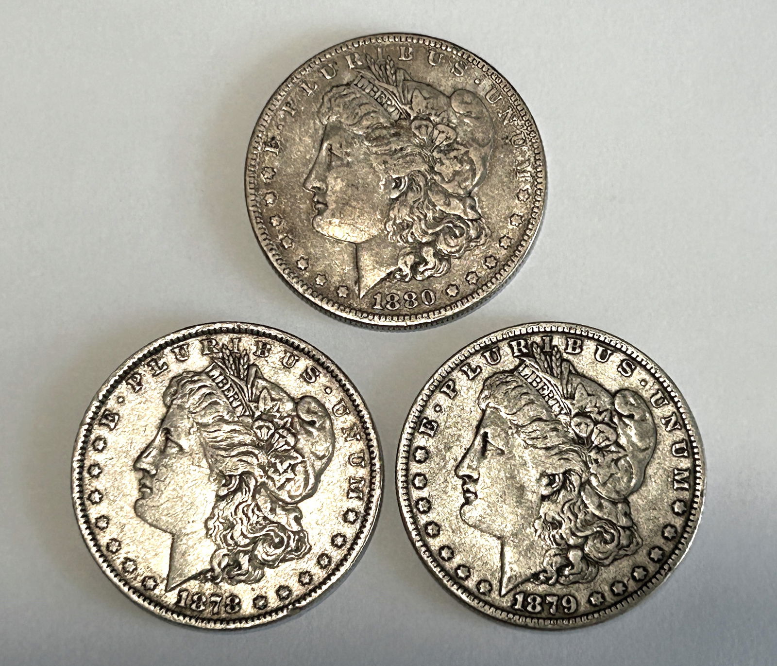 A LOT OF THREE AMERICAN $1 MORGAN SILVER DOLLARS, CIRCA 1878, 1879 AND 1880 (1 of 8)