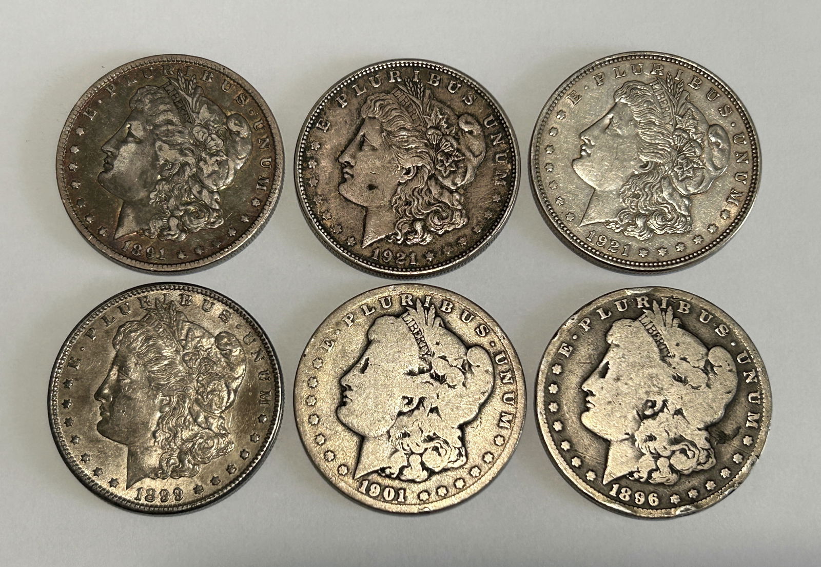 A LOT OF SIX AMERICAN $1 MORGAN SILVER DOLLARS, CIRCA 1891, 1896, 1899, 1901 AND 1921 (1 of 4)