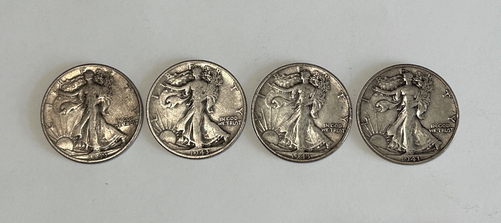 A LOT OF FOUR AMERICAN WALKING LIBERTY HALF SILVER DOLLARS, CIRCA 1941 AND 1943 (1 of 4)