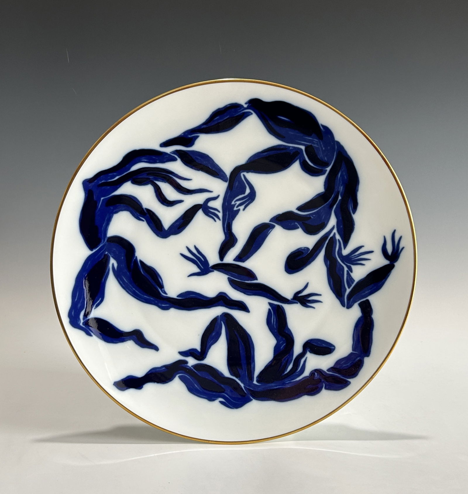 A LARGE FRENCH BERNARDAUD LIMOGES PORCELAIN CHARGER DESIGNED BY HENRI VAN DER STRAETEN, 20TH CENTURY: Decorated with blue and white designer pattern at the front and with designer's name and manufacture's name at the back. In its original box and in brand new condition without any damages or restorati