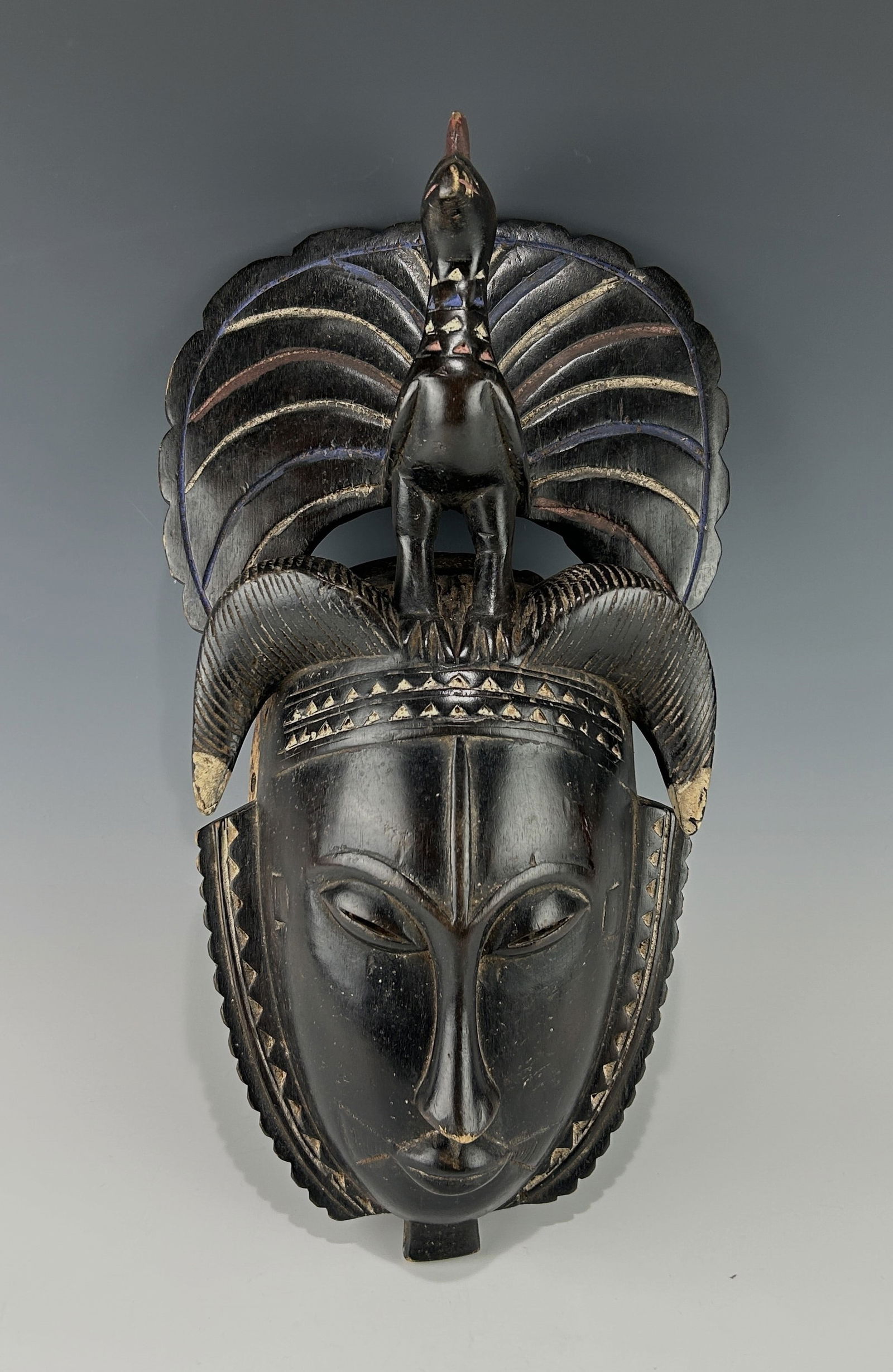 A TRADITIONAL AFRICAN IVORY COAST BAULE WOODEN RAM MASK WITH A PEACOCK ATOP (1 of 8)