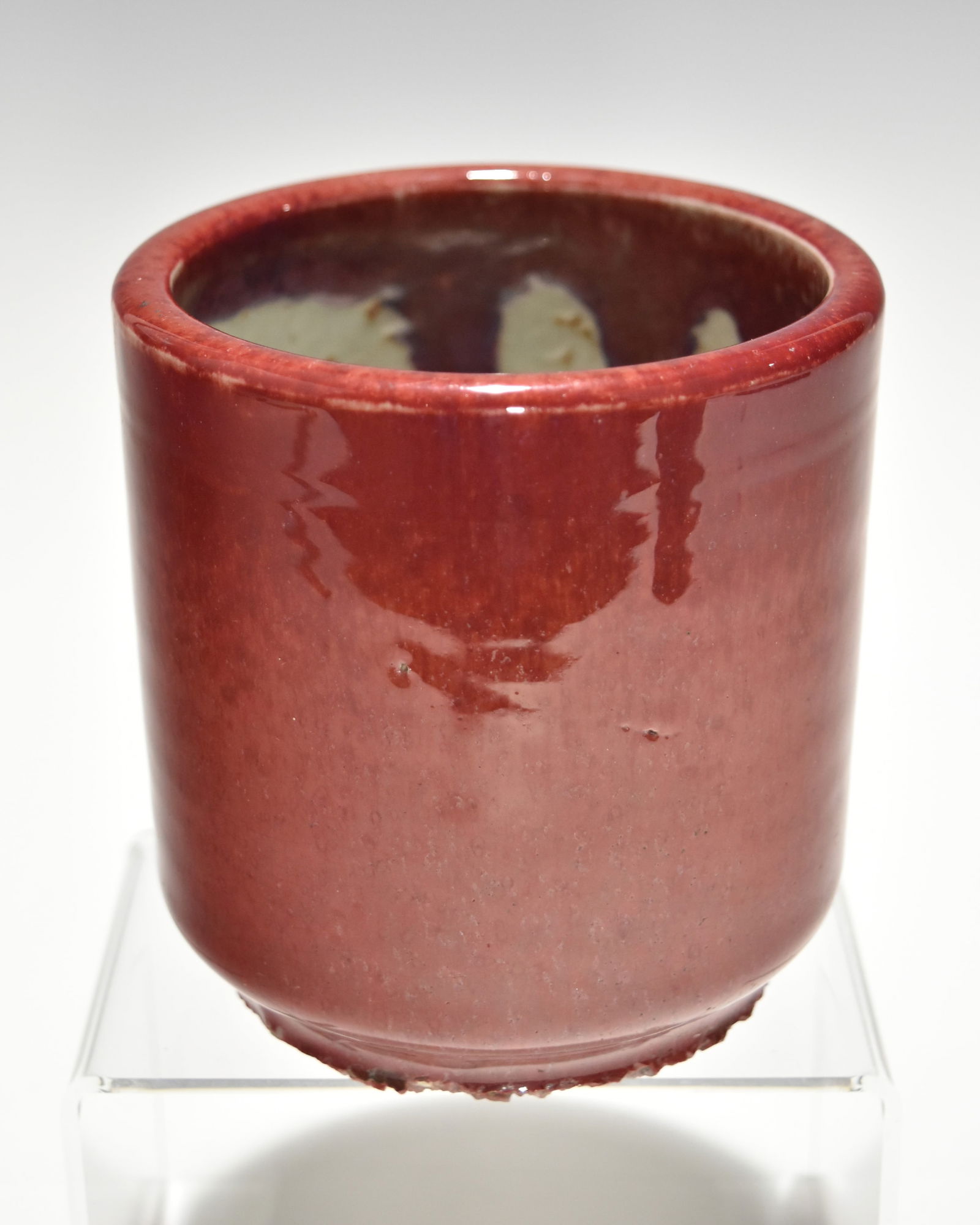 A CHINESE QING DYNASTY COPPER-RED PEACH BLOSSOM GLAZE PORCELAIN BRUSH POT (1 of 6)