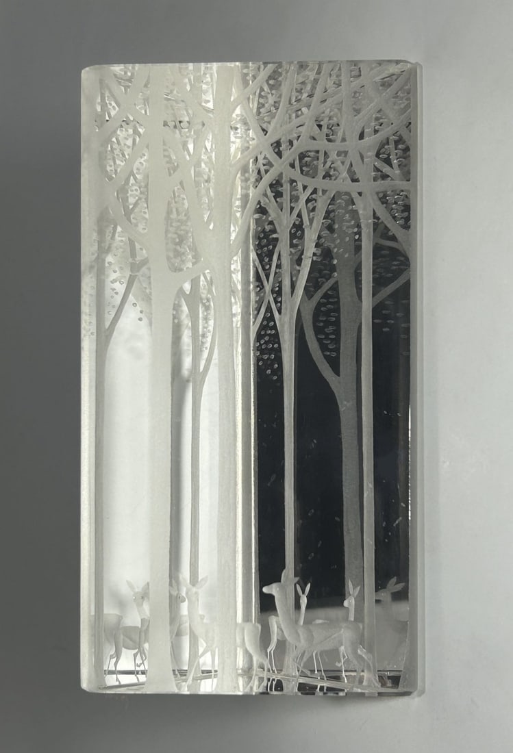 VINTAGE CRYSTAL SCULPTURE "DEERS IN THE FOREST", ETCHED MARK "KOSTA 92412 LINDSTRAND": Circa 1960s. It features an intricately etched winter woodland scene with deer among the trees, artfully depicted in frosted crystal. The piece combines clear and frosted elements to create a three-di