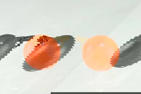 VINTAGE 14K GOLD NATURAL CORAL CLIP-ON EARRINGS: A classic pair of vintage clip-on earrings featuring natural coral cabochons set in 14K gold (tested). The coral displays a soft, warm hue with natural striations and surface characteristics typical o