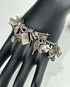 VINTAGE STERLING SILVER CHARM BRACELET WITH MINIATURE FIGURAL CHARMS