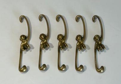FIVE VINTAGE MID-CENTURY BRASS MONKEY WARDROBE/PLANT HOOKS BY WALTER BOSSE