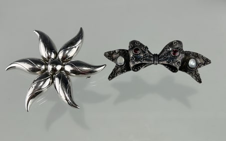 TWO VINTAGE STERLING SILVER BROOCHES: FLORAL AND BOW