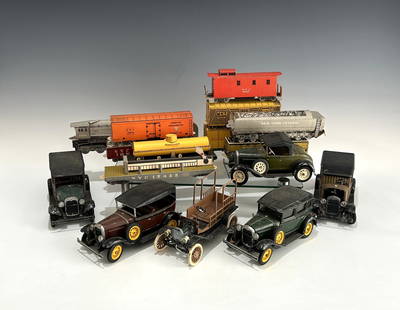SIX VINTAGE ASSEMBLED HUBLEY DIE CAST METAL TOY AUTOMOBILES PLUS CARBOARD TRAIN MODELS: Circa 1970s, including 5 marked Hubley Toys, with detailed features such as spoked wheels, running boards, and folding tops. Plus 10 assortment of carboard pieces of the Seven foot train model set, in