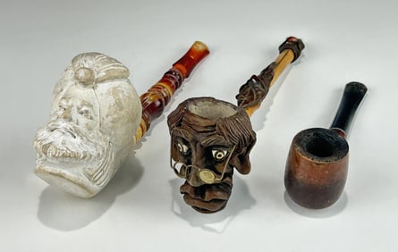 THREE VINTAGE PIPES INCLUDING A CARVED MEERSCHAUM PIPE AND A WOODEN WHIMSICAL FACE ONE