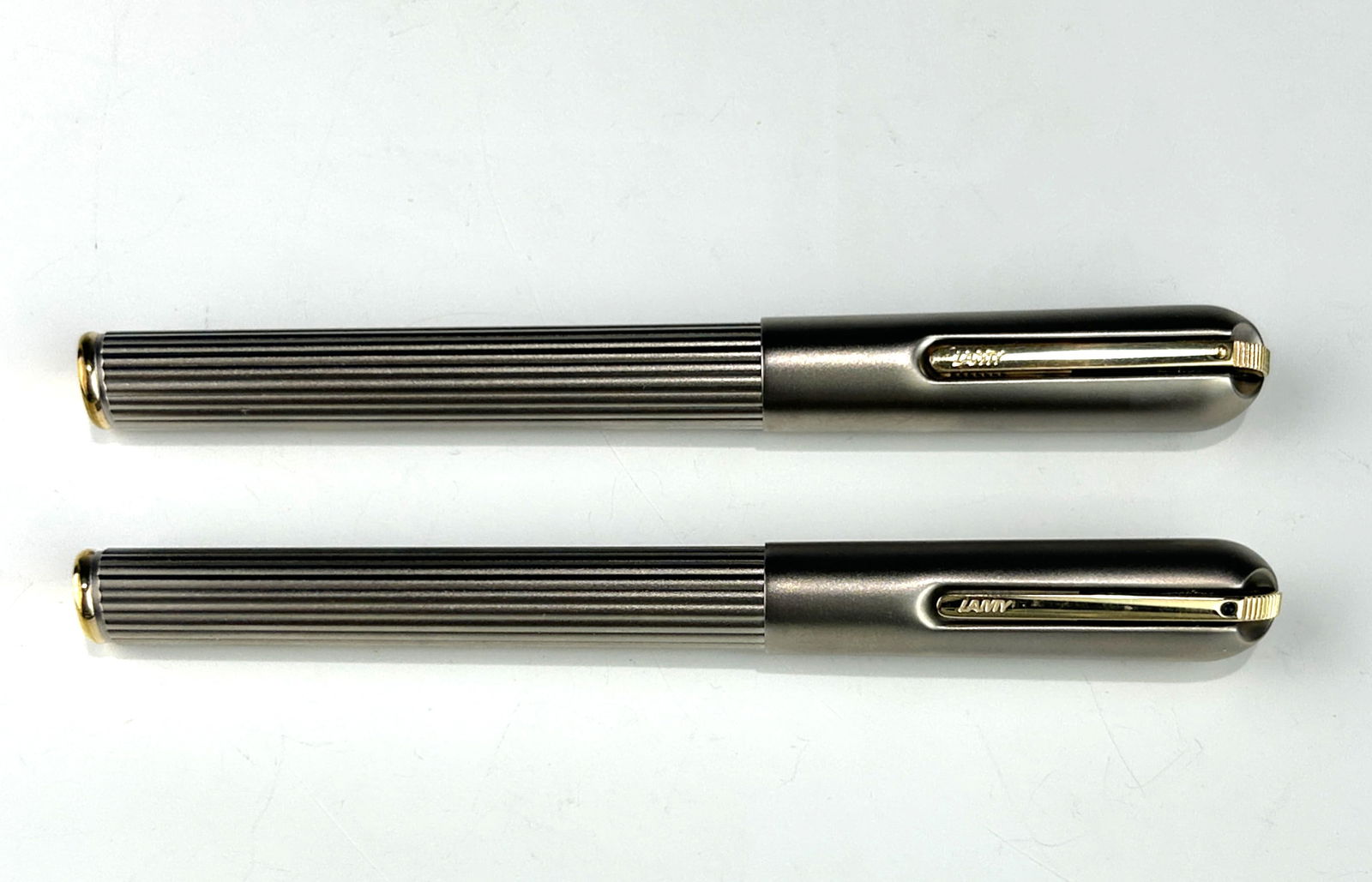 LAMY STAINLESS STEEL RIBBED FOUNTAIN PEN WITH 18K GOLD NIB & MATCHING ROLLERBALL PEN (1 of 3)