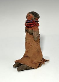 HANDMADE CLAY FIGURE WITH VIBRANT BEADS AND TEXTILE DRESS