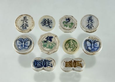 A COLLECTION OF TEN ANTIQUE CHINESE QING DYNASTY PORCELAIN COIN TOKENS