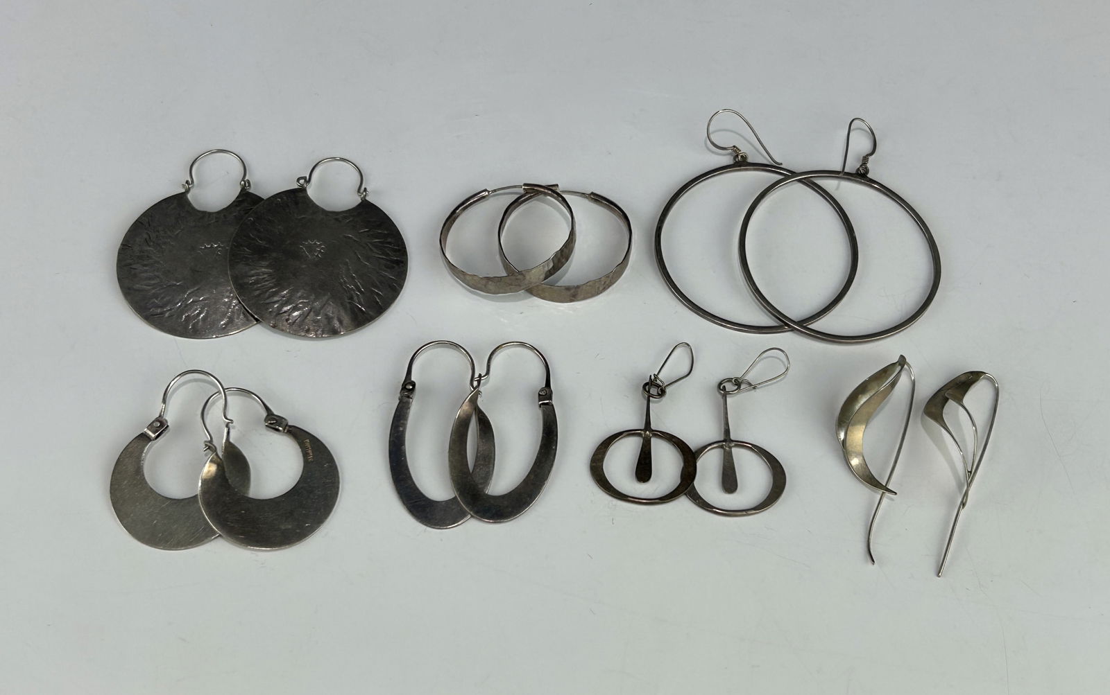 LOT OF SEVEN PAIRS OF VINTAGE MODERNIST AND HOOP EARRINGS, INCLUDING STERLING SILVER (1 of 6)
