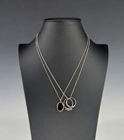 TWO VINTAGE NECKLACES WITH ONYX PENDANT AND RING CHARMS