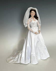 THE PRINCESS KATE BRIDE DOLL, COMMEMORATIVE EDITION: Circa 2011. Franklin Mint porcelain doll commemorating the royal wedding of April 29, 2011, dressed in a satin and lace bridal gown with long train, lace veil, and tiara. Features lifelike facial deta