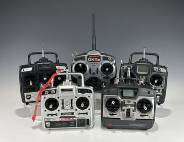 GROUP OF FIVE VINTAGE R/C MODEL AIRPLANE CONTROLLERS: FUTABA, JR, AND SPEKTRUM