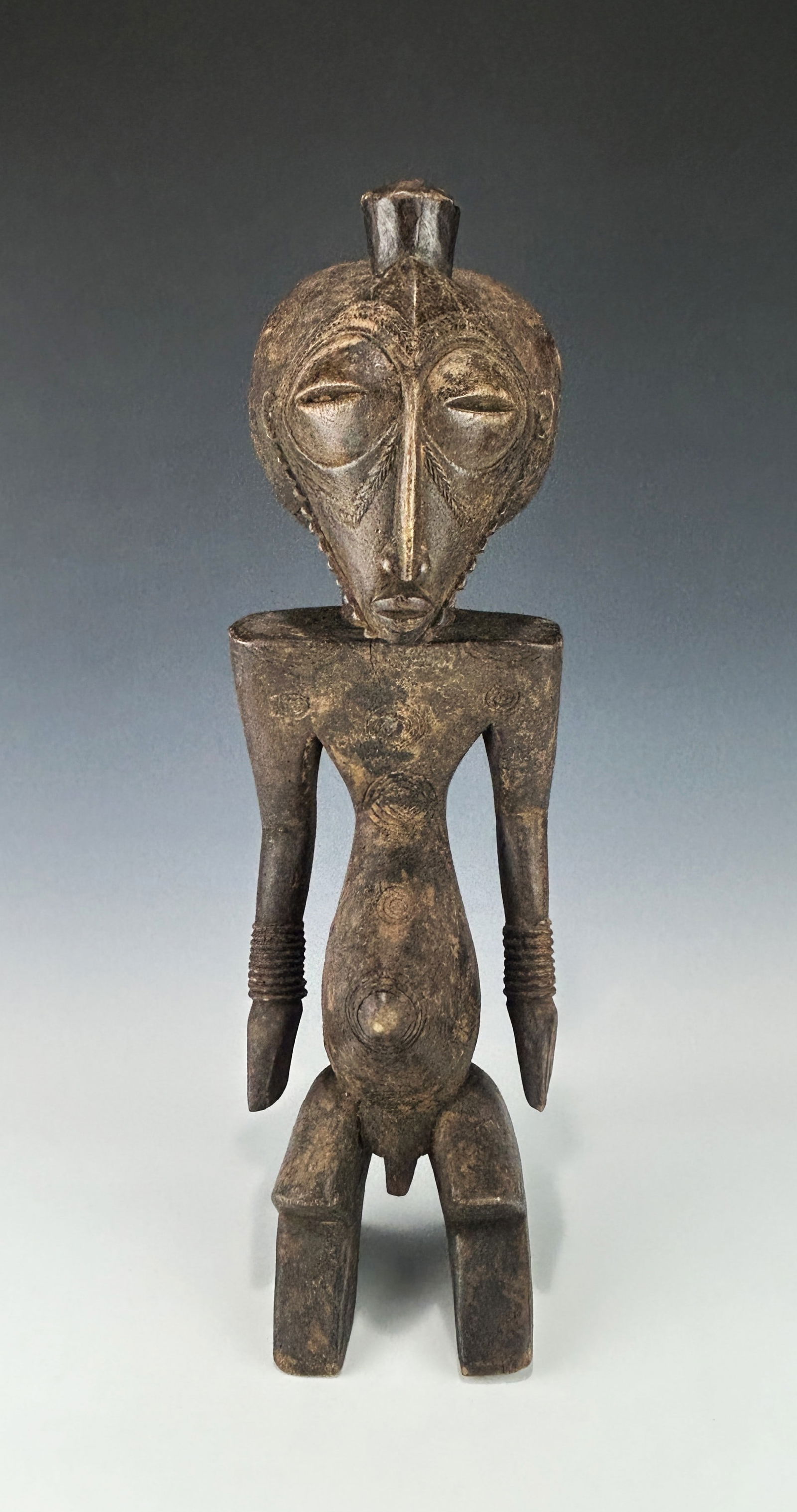 A RARE AND IMPORTANT BASIKASINGO ANCESTOR FIGURE (MIZI) (1 of 5)