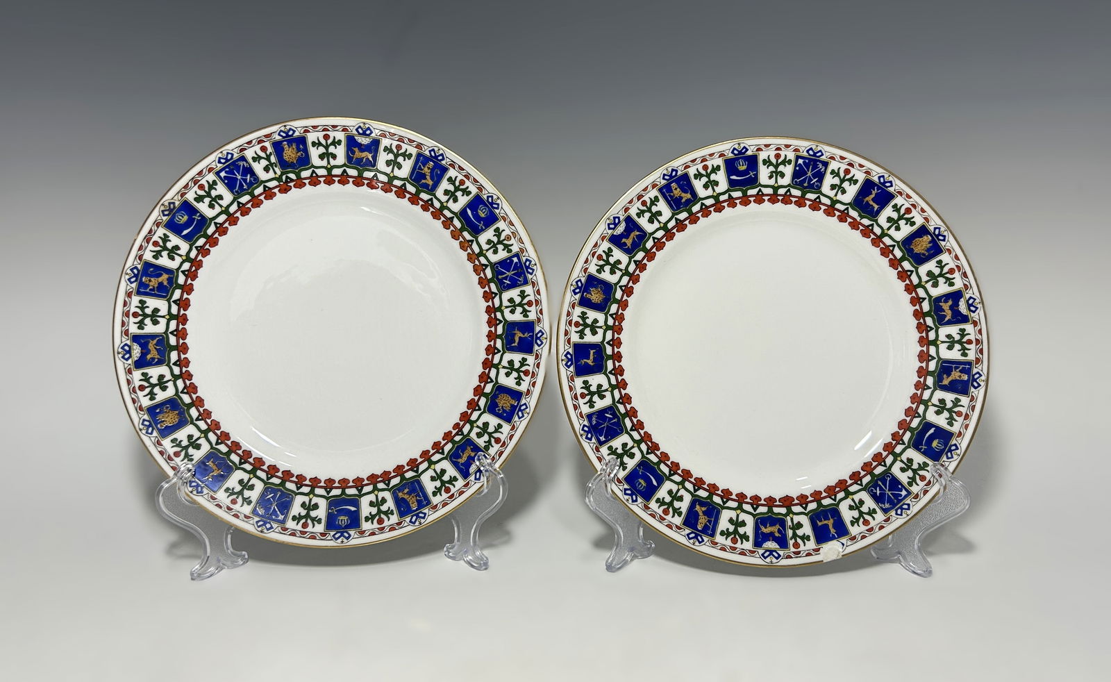 PAIR OF ANTIQUE KORNILOW BROS. FOR TIFFANY & CO. RUSSIAN PORCELAIN PLATES: Circa 1900–1917, manufactured by Kornilow Brothers, St. Petersburg, Russia, for Tiffany & Co., New York, fine Russian porcelain dessert plates featuring intricate Pan-Slavic folk ornamentation. The