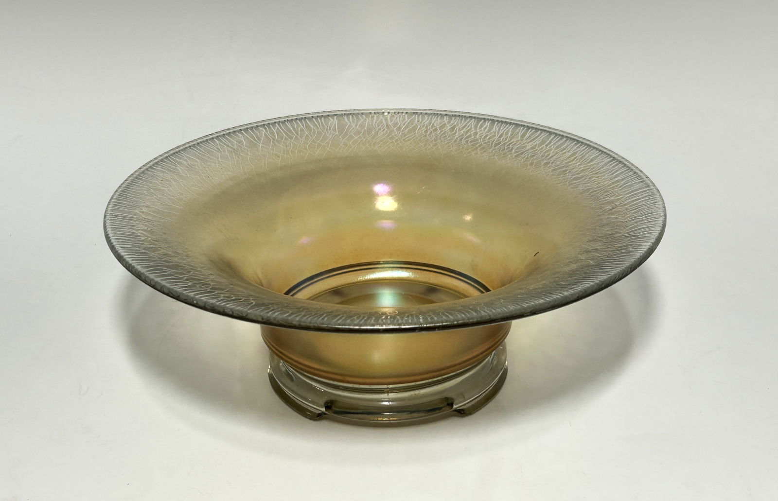 VINTAGE MARIGOLD IRIDESCENT STRETCH GLASS CONSOLE BOWL: Circa 1915 to 1930s, a large, vintage centerpiece or console bowl crafted in the "stretch glass" production style, finished in a luminous marigold iridescence, a light version of the classic orange-go