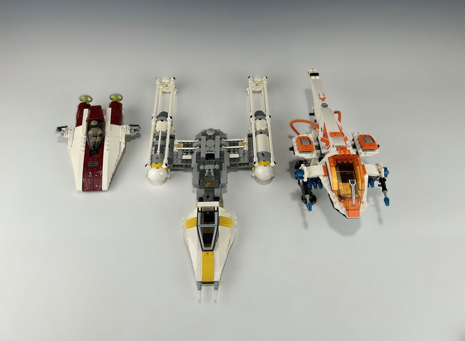 THREE VINTAGE LEGO STAR WARS AND MARS MISSION SPACECRAFT: Iconic retired LEGO vehicle sets from the Star Wars and Mars Mission themes, dating from 2007 to 2013, including one LEGO Star Wars Y-wing Fighter released in 2007, one LEGO Star Wars A-wing Starfight