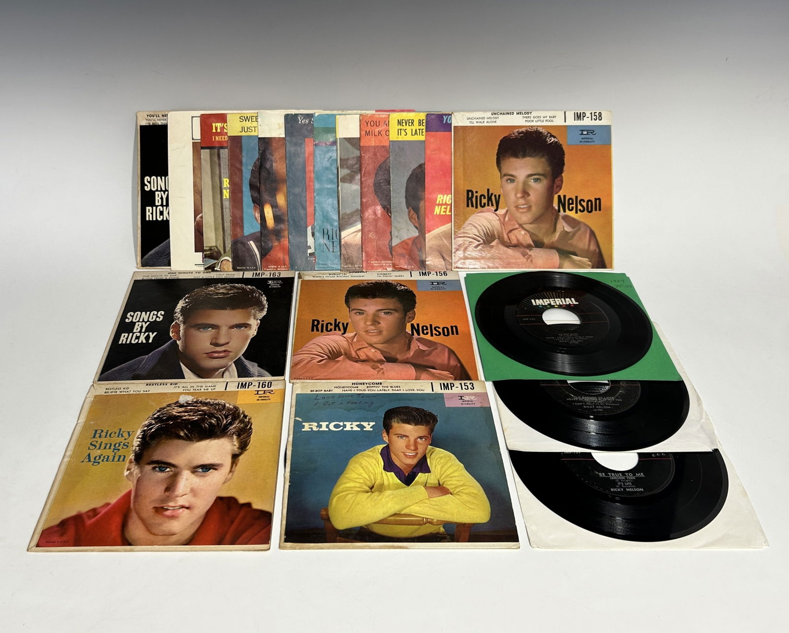 VINTAGE RICKY NELSON 45 RPM RECORDS WITH EPs AND EMPTY PICTURE SLEEVES: Group of vintage 45 RPM records featuring American rock-and-roll and pop singer Ricky Nelson, issued on Imperial Records. The lot includes four extended-play (EP) 4-song records, three 3-song records,