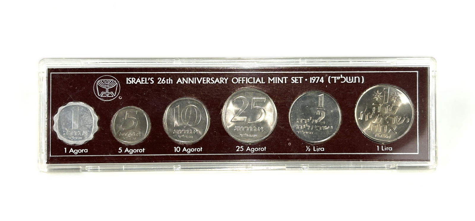 1974 ISRAEL 26TH ANNIVERSARY OFFICIAL MINT SET OF SIX MINT COINS: A six-coin commemorative collection issued by the Bank of Israel. It features uncirculated circulation coins of that year. Each coin is distinguished by a small Star of David mint mark on the obverse