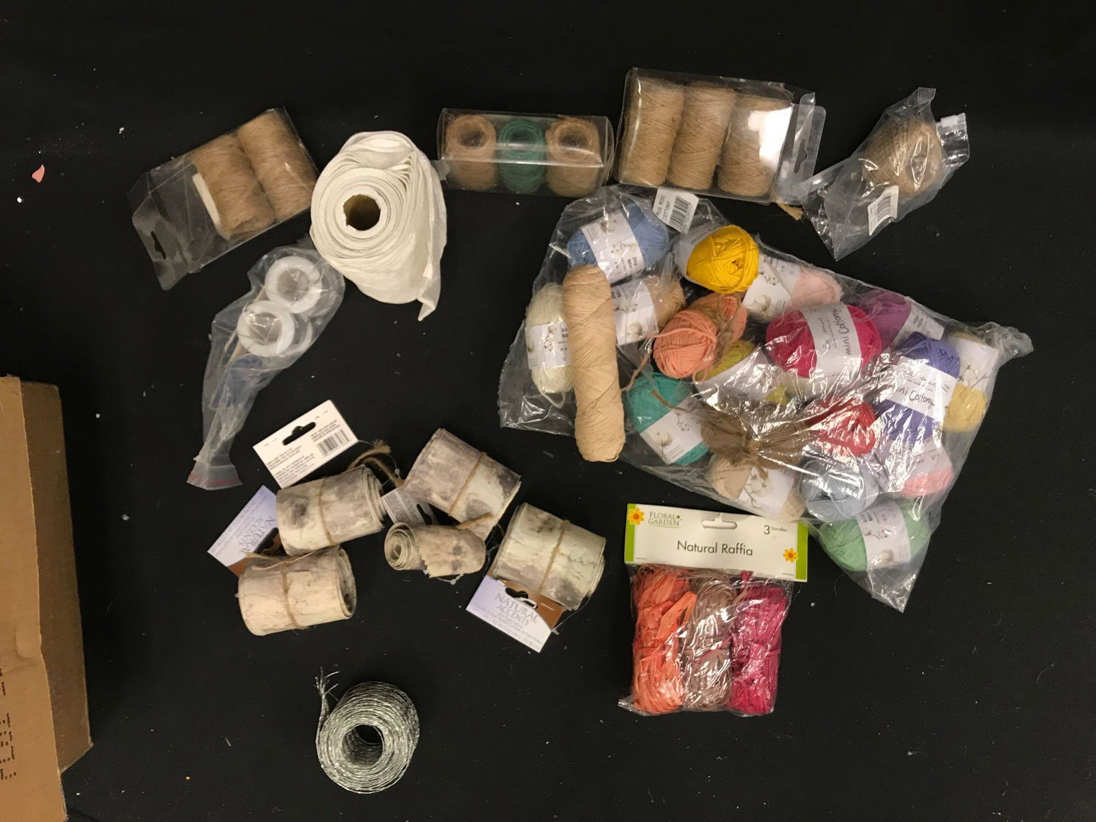 Colored Yarn and other supplies: Box of craft supplies includes colored yarn, birch paper garland, natural raffia, chicken wire and more